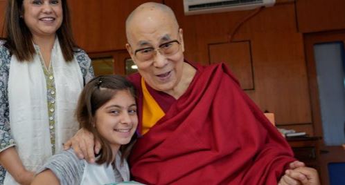 His Holiness the Dalai Lama speaking to a young girl at his residence in Dharamshala, HP, India on June 10, 2019. Photo: OHHDL