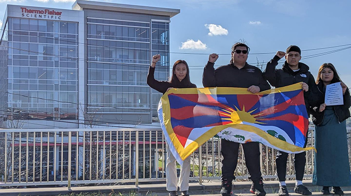 Activists from Students for a Free Tibet demonstrate against Thermo Fisher Scientific in front of its building on December 6, 2022. Photo: file