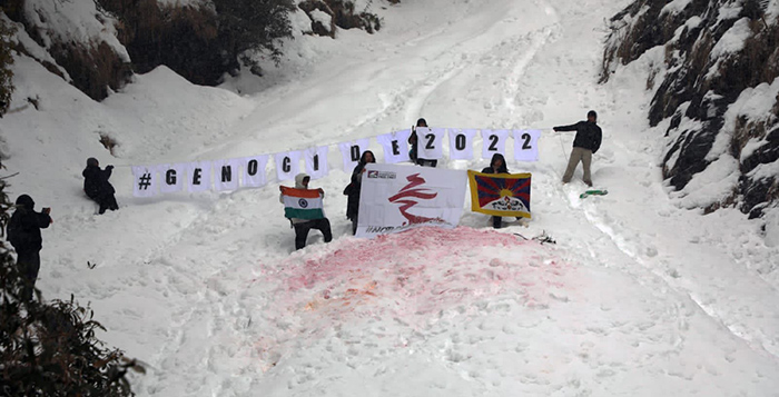 Tibetan activists from SFT-India hold a protest in the snow on the high mountain of Dhauladhar in Dharamshala on January 28, 2022, with a message "GENOCIDE 2022". Photo: SFT