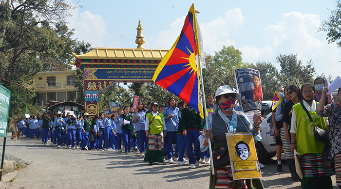 Tibetans march from Mcleod Ganj to Kacheri in Dharamshala to commemorate the 64th anniversary of the Tibetan Women's National Uprising Day on March 12, 2023. Photo: TPI