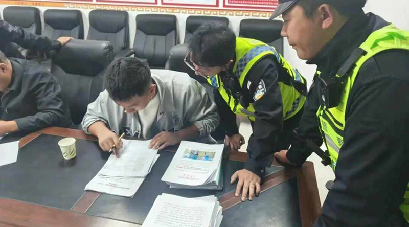 A Tibetan signs a document under the supervision of officials in Dingri county, southern Tibet. (Representative photo)