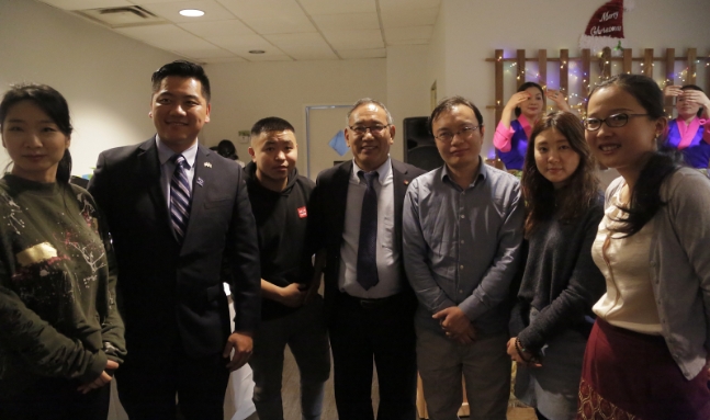 Representative Ngodup Tsering and Chinese Liaison Officer, Tsultrim Gyatso with Chinese youths at the exchange dinner event. Photo: Chinese Liaison Office, OOT Washington DC