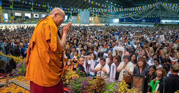 His Holiness the Dalai Lama greeting the audience on his arrival on stage at Skonto Hall in Riga, Latvia on June 16, 2018. Photo by Tenzin Choejor