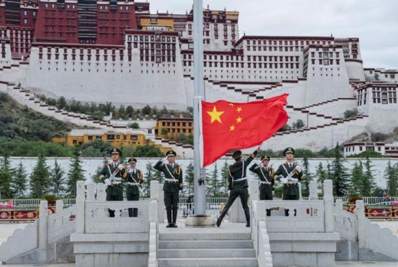 Chinese military forces raising the Chinese flag over Lhasa, Tibet. Photo: file