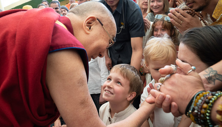 His Holiness the Dalai Lama greeting younger members of the audiences from around the world at the main Tibetan temple in Dharamsala, HP, India on May 19, 2018. Photo: Tenzin Choejor