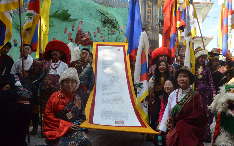 Protesters holding a large banner of the Proclamation of Independence for Tibet Issued by the 13th Dalai Lama, in 1913, in Dharamshala, India, on February 13, 2020. Photo: TPI/Yangchen Dolma