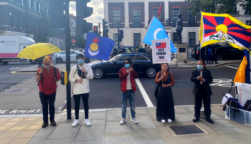 Protestors hold up an item to represent five communities that are under attack by the CCP. From left to right: Hong Kong, South Mongolia, East Turkestan, Taiwan and Tibet. Photo: Free Tibet, UK
